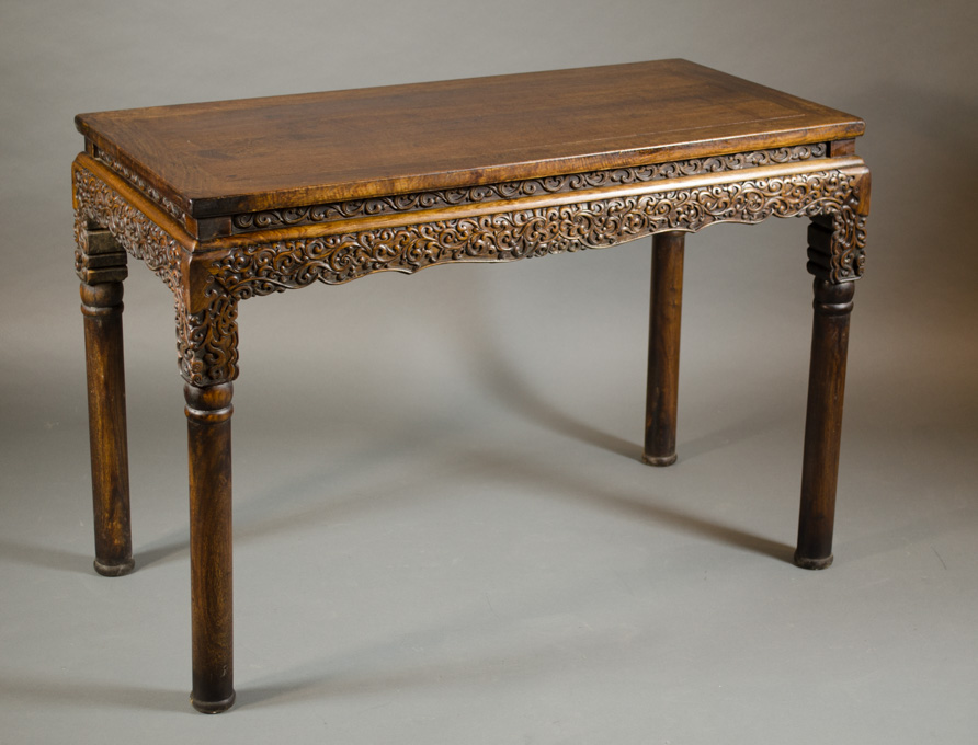 Appraisal: CHINESE CARVED HUALIMU ALTER TABLE having a floating rectangular top