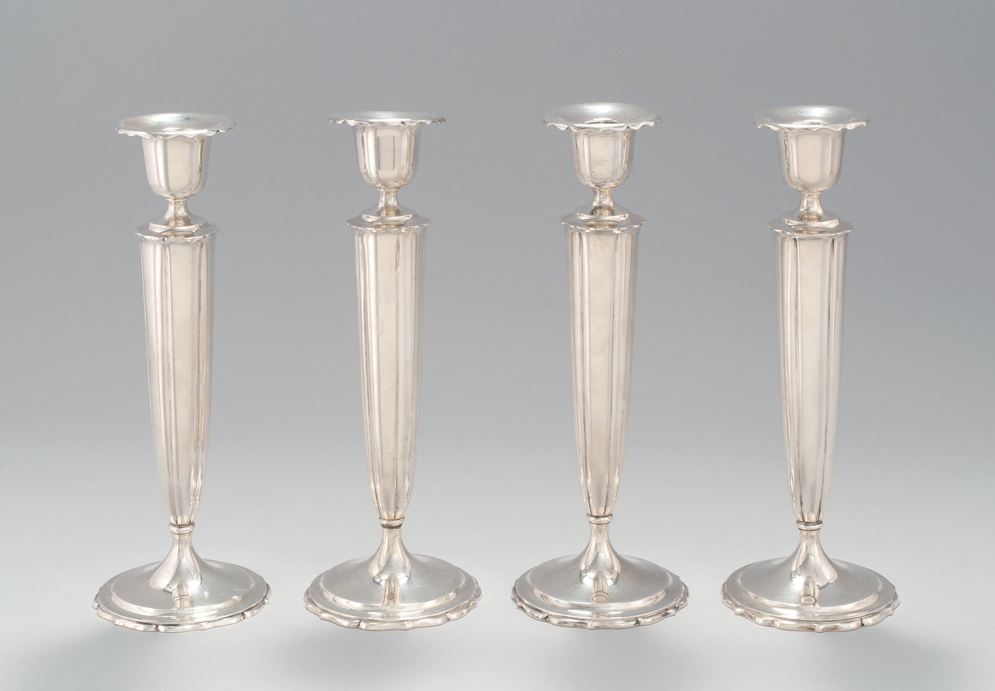 Appraisal: SET OF FOUR STERLING SILVER WEIGHTED TALL CANDLE STICKS In