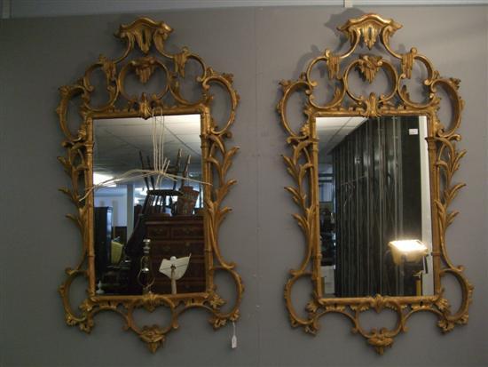 Appraisal: Pair of Rococo style carved gilt wood wall mirrors with