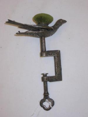 Appraisal: A VICTORIAN SEWING AID CLAMP of squared form moulded with