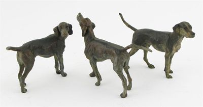 Appraisal: Three early th century well modelled bronzes of hounds dark