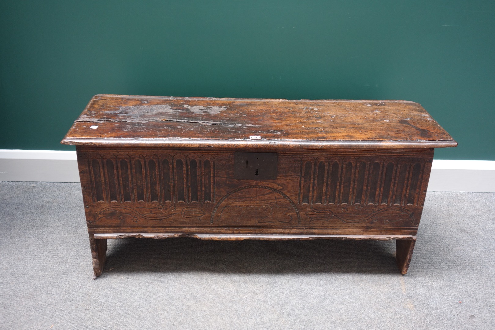 Appraisal: A late th century oak five plank coffer with carved