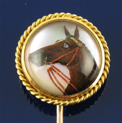 Appraisal: A late th century gold stick pin mounted with a