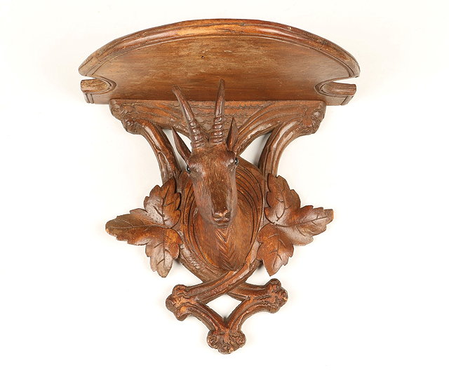 Appraisal: A TH CENTURY BLACK FOREST CARVED WALL BRACKET in the