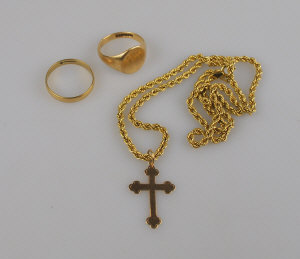 Appraisal: Two ct rings to w ct rope chain and cross