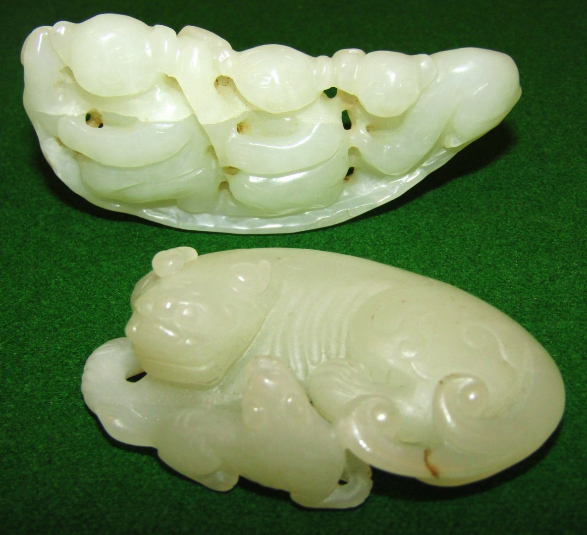 Appraisal: Two Chinese jade figures comprising a partially carved group of