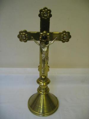 Appraisal: AN ARTS AND CRAFTS BRASS CRUCIFIX studded with red and