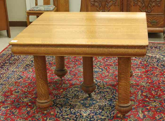 Appraisal: SQUARE OAK DINING TABLE WITH THREE LEAVES American c the