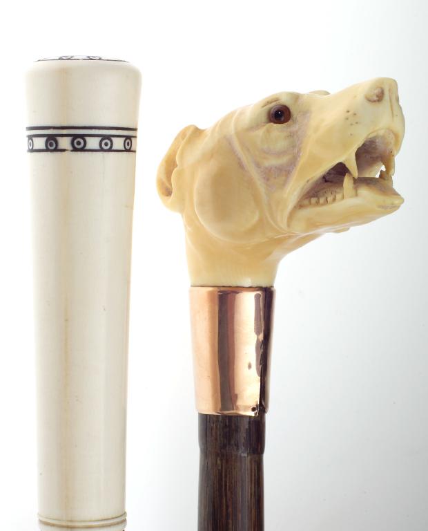 Appraisal: EDWARDIAN GOLD-MOUNTED IVORY-HANDLED BAMBOO CANE the handle well-carved as the