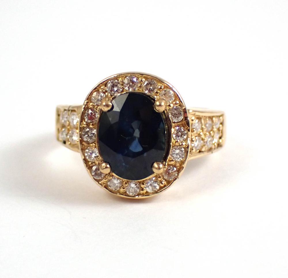 Appraisal: SAPPHIRE DIAMOND AND FOURTEEN KARAT GOLD RING with round-cut diamonds