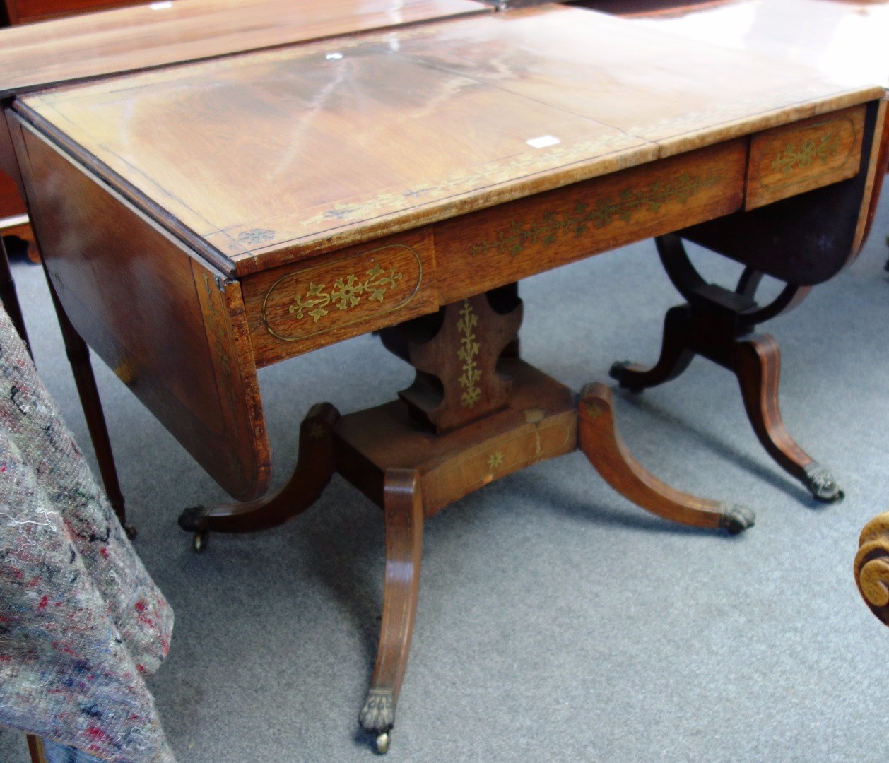 Appraisal: A late George III brass inlaid rosewood sofa table on