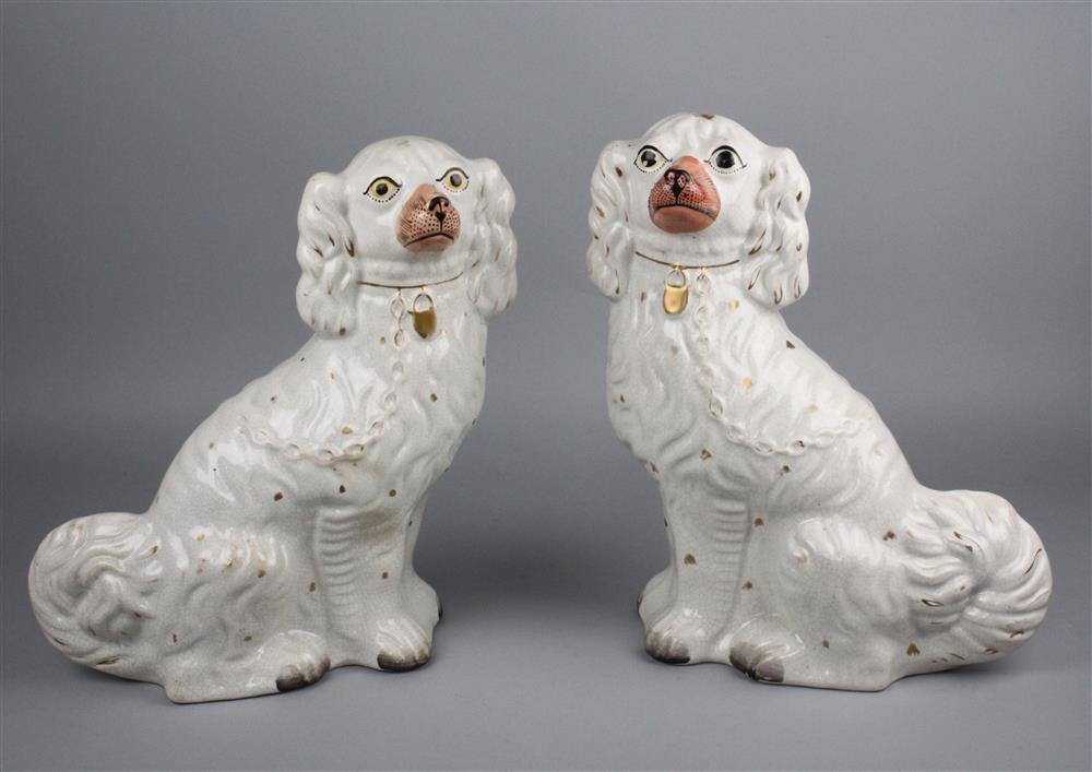 Appraisal: PAIR OF STAFFORDSHIRE FIGURES OF SPANIELS late th Century each