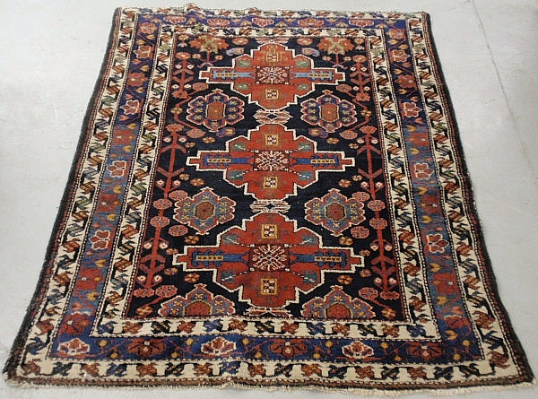 Appraisal: - Shirvan oriental center hall carpet with three red geometric