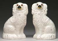 Appraisal: PAIR OF ANTIQUE STAFFORDSHIRE SEATED SPANIELS Second half of the