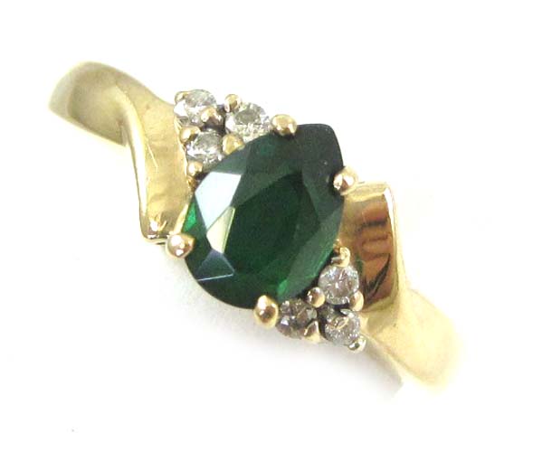 Appraisal: EMERALD DIAMOND AND TEN KARAT GOLD RING set with six