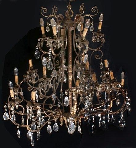 Appraisal: A ROCOCO STYLE BRASS TWELVE BRANCH CHANDELIER with open scroll