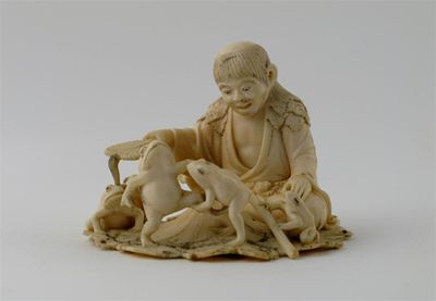 Appraisal: A Japanese ivory okimono of a figure seated on a