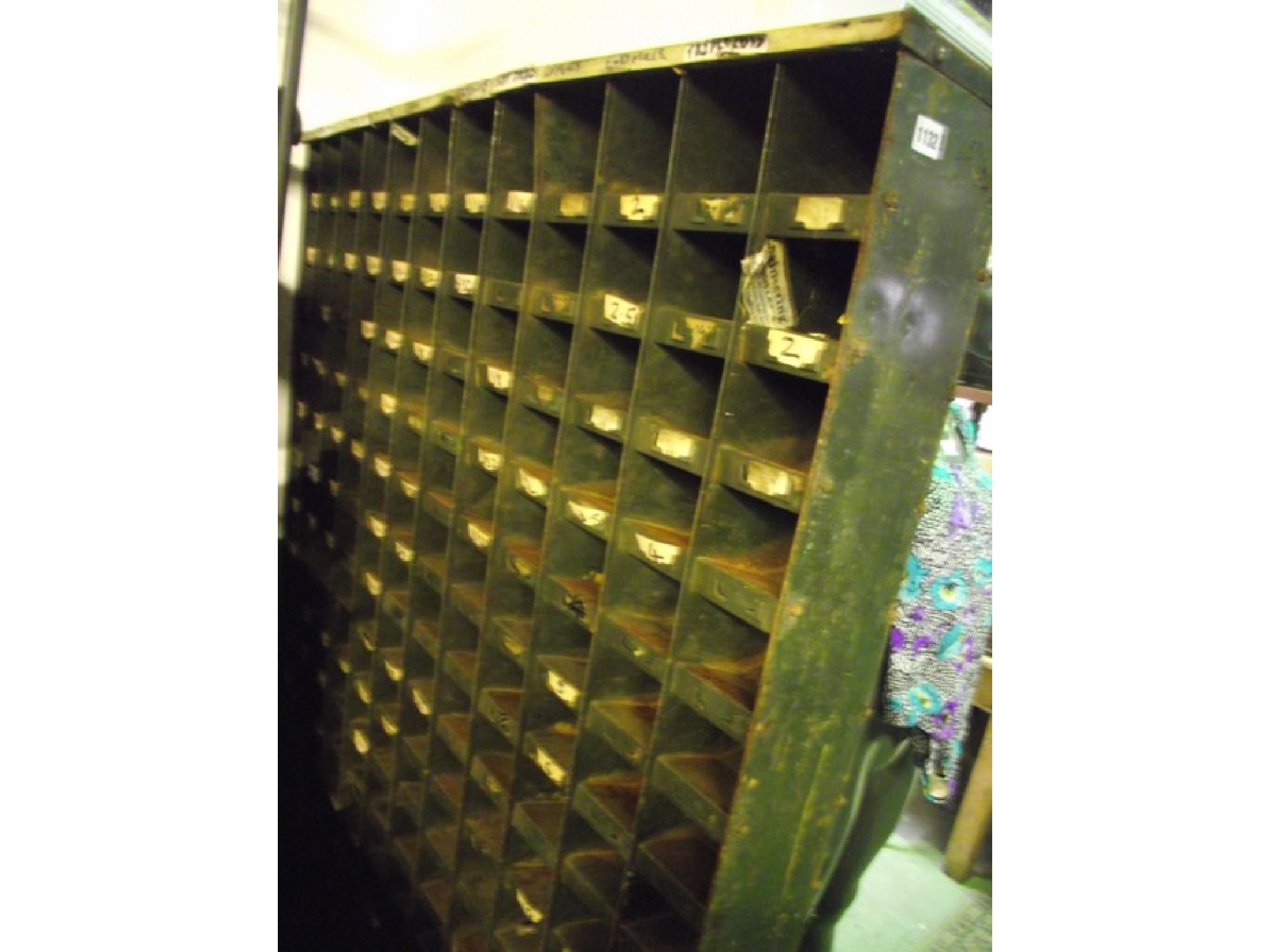 Appraisal: A freestanding flight of industrial steel pigeon holes with original