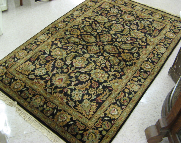 Appraisal: HAND KNOTTED ORIENTAL AREA RUG Indo-Persian overall floral decoration on