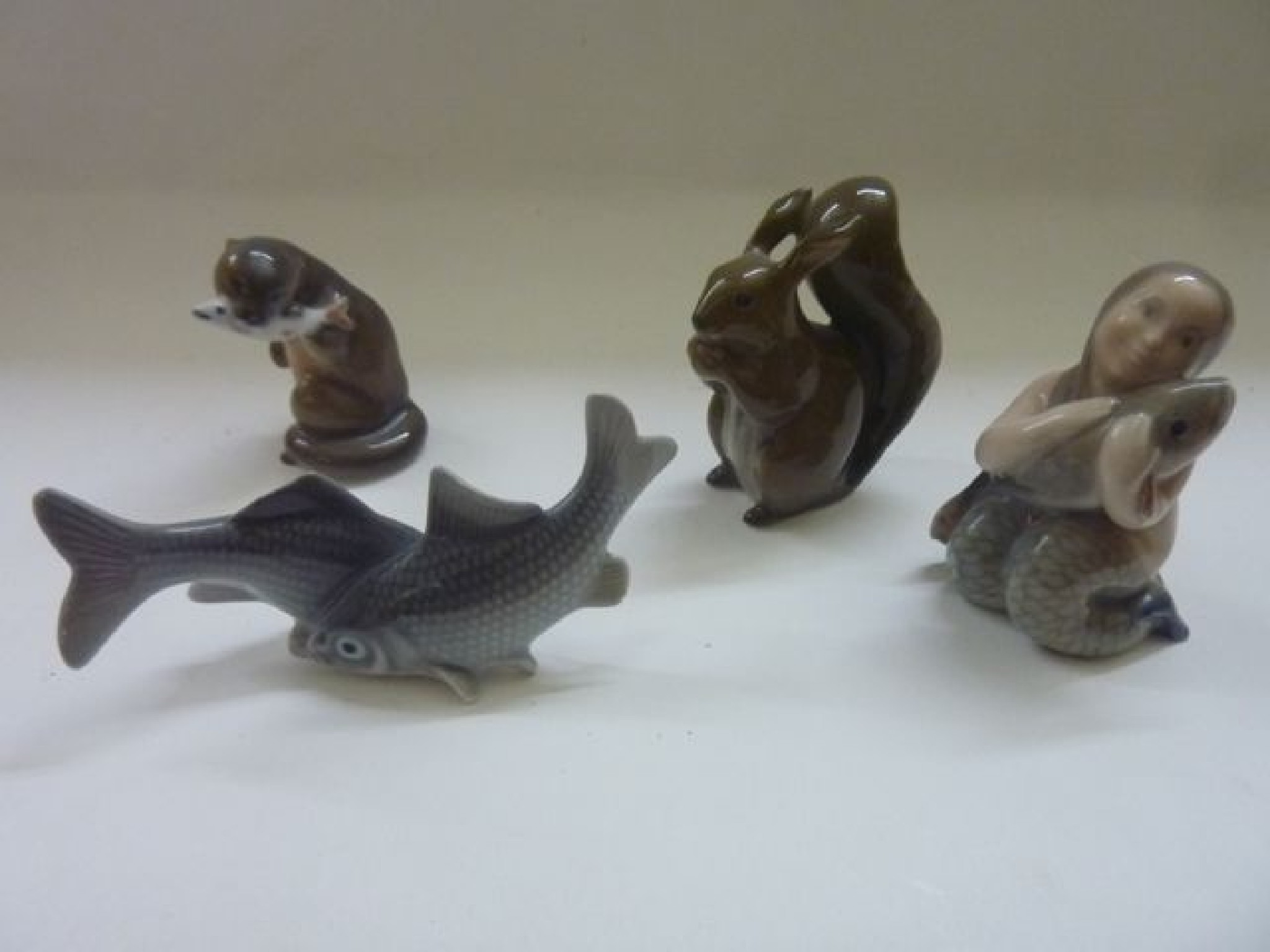 Appraisal: Four pieces of small Copenhagenware comprising a red squirrel number