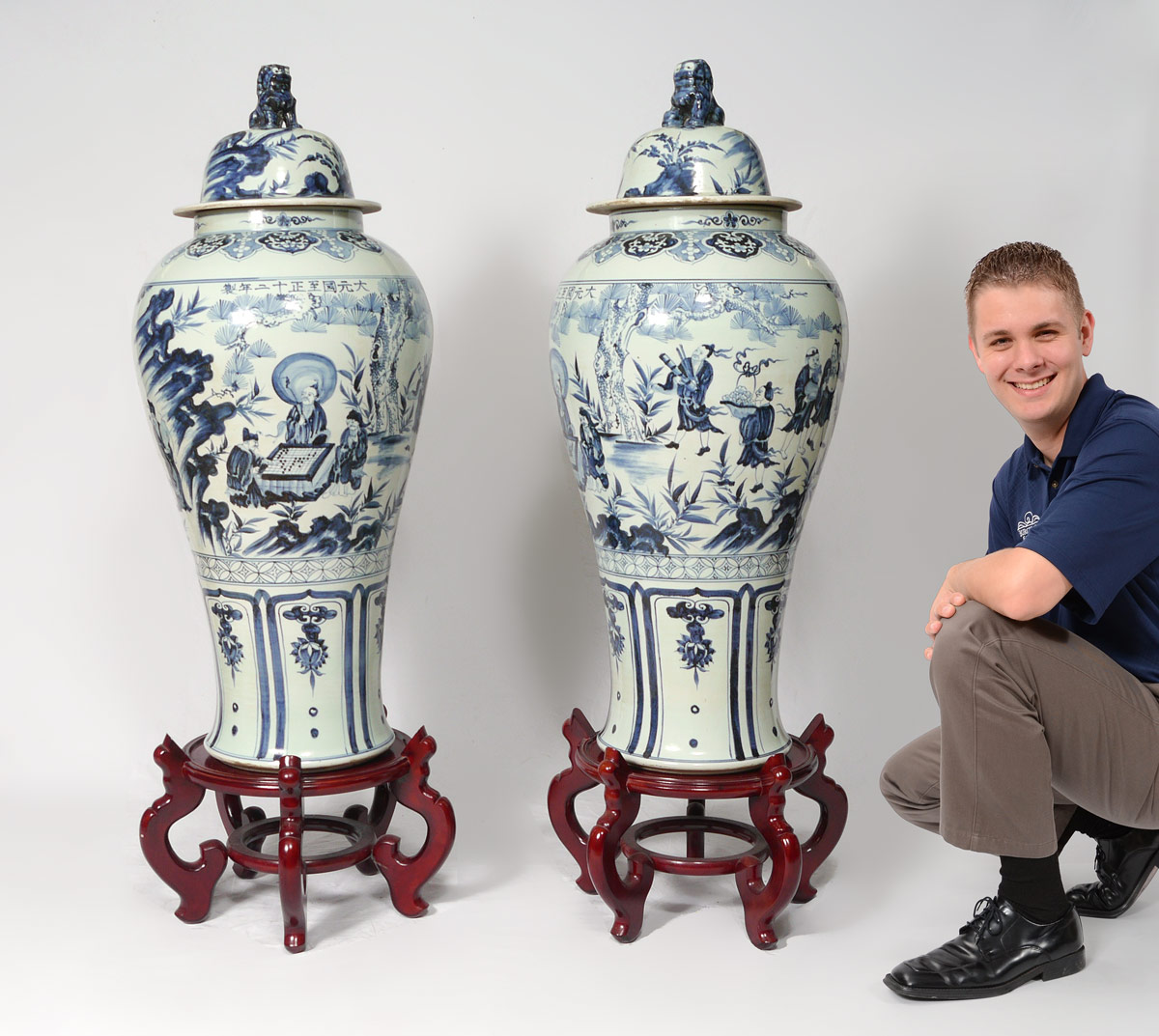 Appraisal: PAIR ORIENTAL BLUE WHITE PALACE URNS Palatial in size blue