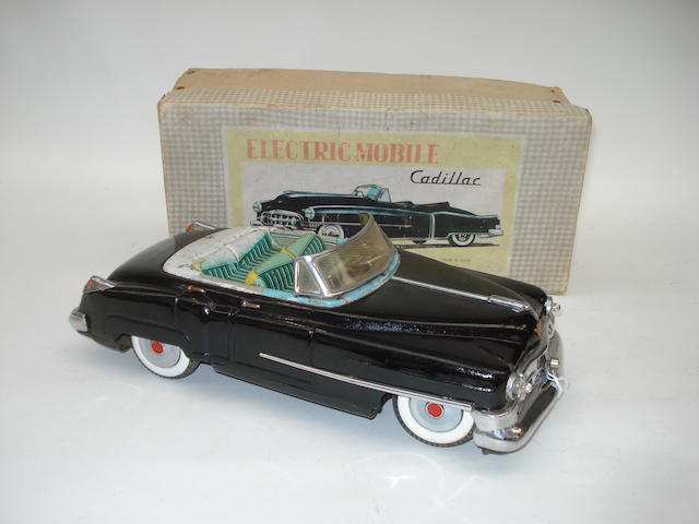 Appraisal: Nomura TN boxed tinplate battery operated open-top Cadillac Japanese s