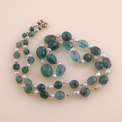 Appraisal: A graduated emerald bead necklace Separated with seed pearls cm