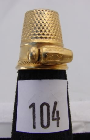 Appraisal: Gold tone needle pulling thimble