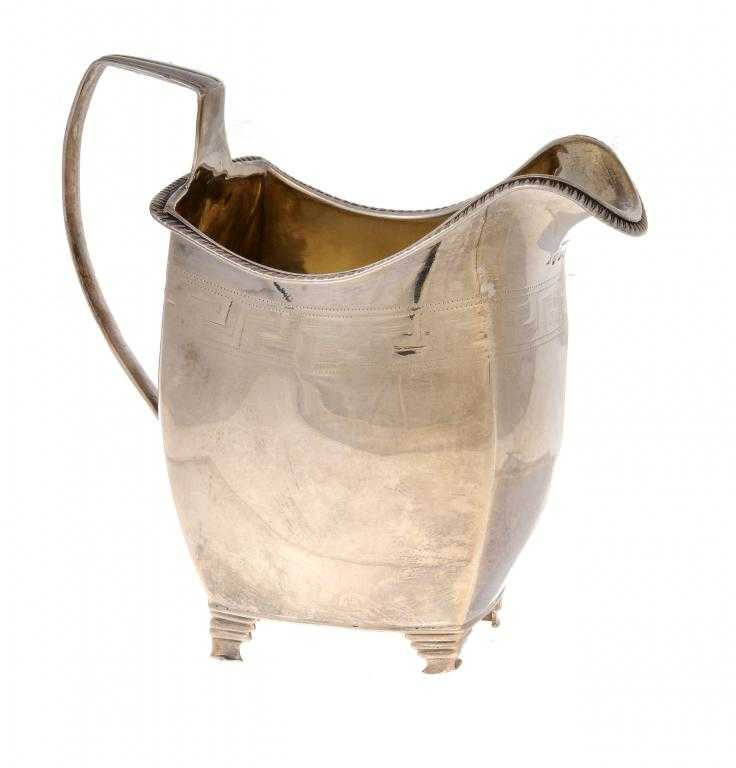 Appraisal: A GEORGE III CREAM JUG of almost square shape with