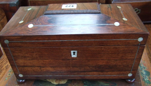 Appraisal: A Regency rosewood and mother of pearl inlaid sarcophagus tea