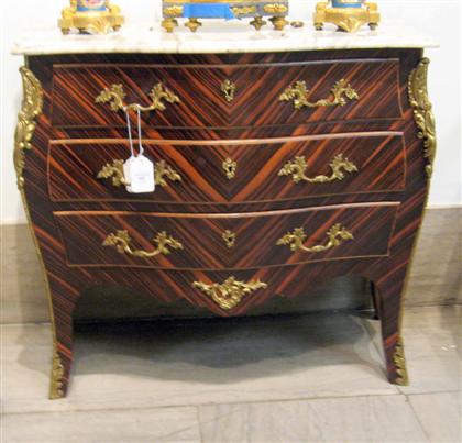 Appraisal: Macassar ebony and marble top bombe commode The white marble