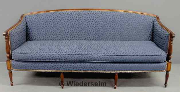 Appraisal: Sheraton style mahogany sofa with reeded legs and blue upholstery