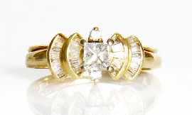 Appraisal: A ct gold princess and baguette cut diamond ring with