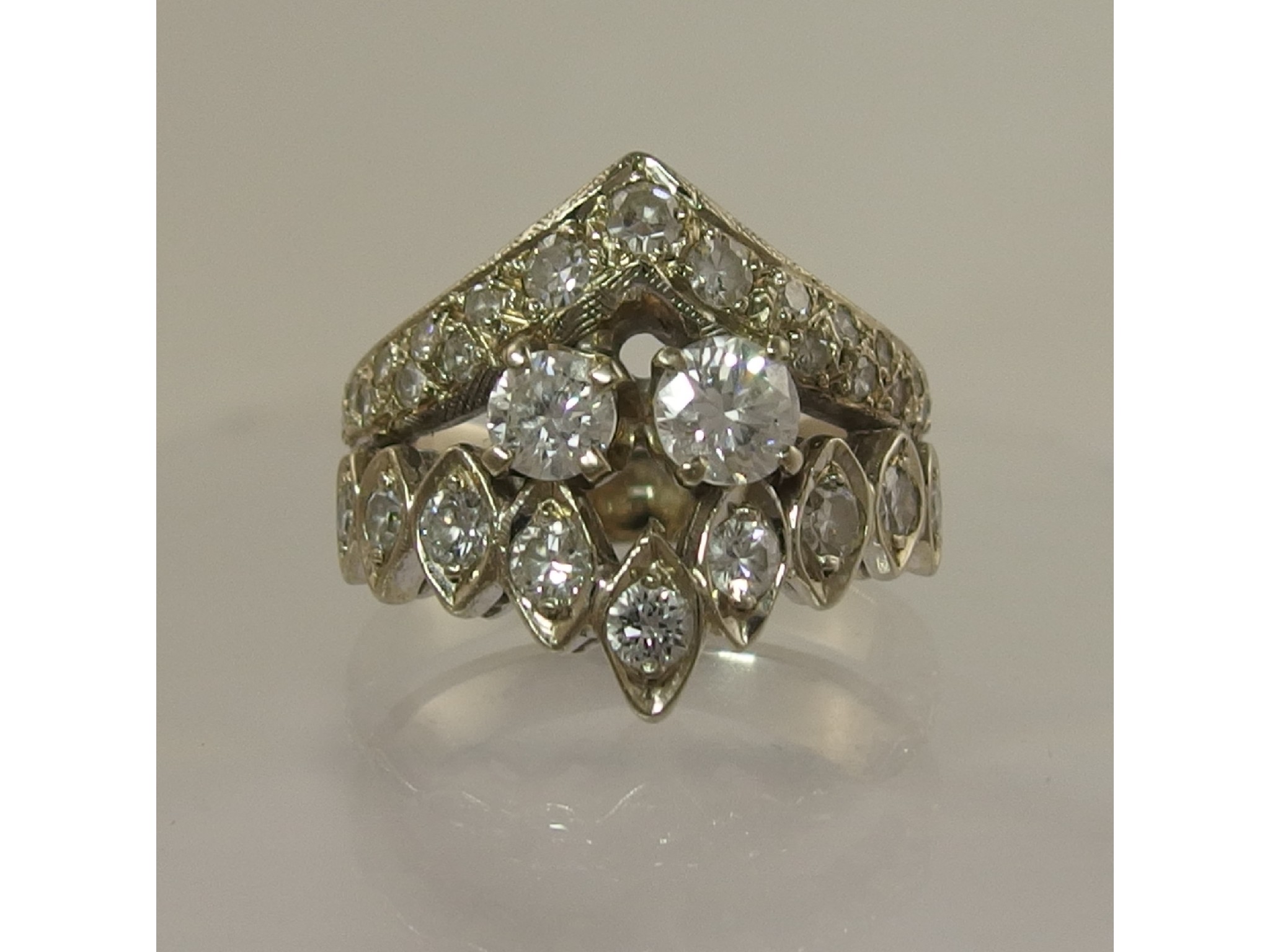 Appraisal: A ct white gold diamond set dress ring the bottom