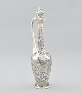 Appraisal: A Silver Overlay Ewer with Stopper A clear glass with