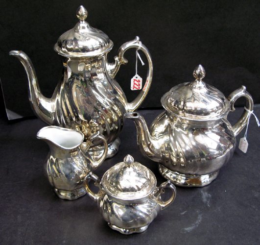 Appraisal: A GERMAN FOUR PIECE SILVER OVER PORCELAIN COFFEE AND TEA