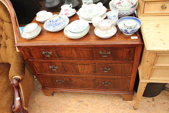 Appraisal: A MAHOGANY CHEST of three long drawers standing on bracket