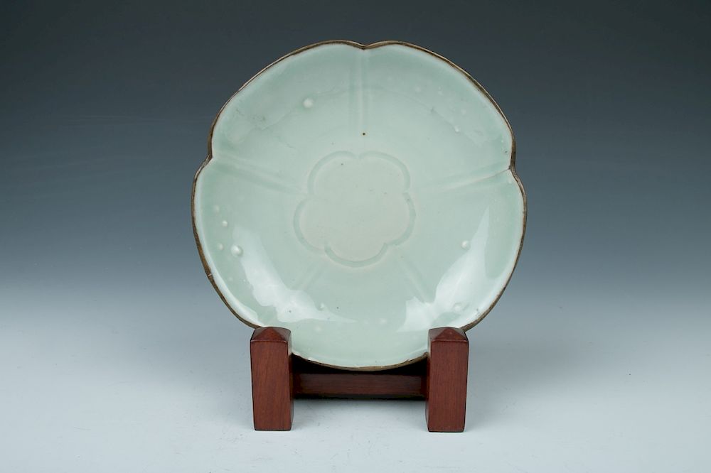 Appraisal: CELADON GLAZE PLATE Of five petal everted form rising from