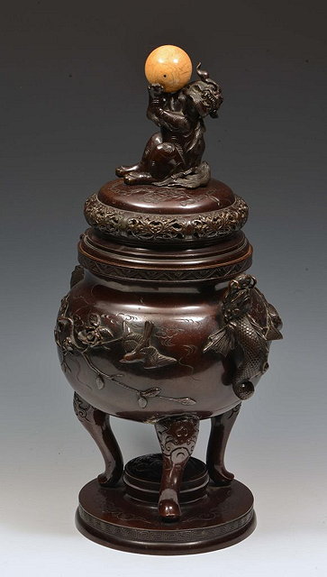 Appraisal: A JAPANESE BRONZE KORO and cover with kylin finial holding