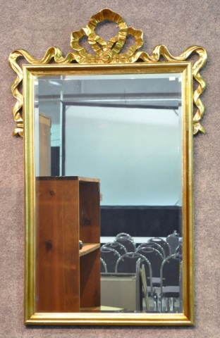 Appraisal: Gold Finished Framed Wall MirrorWith beveled glass and French-style ribbon