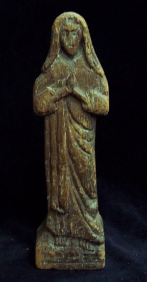 Appraisal: A carved wood figure of the Madonna at prayer cm