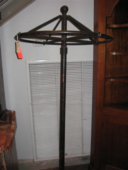 Appraisal: Iron rotating coat rack th century with molded detail H