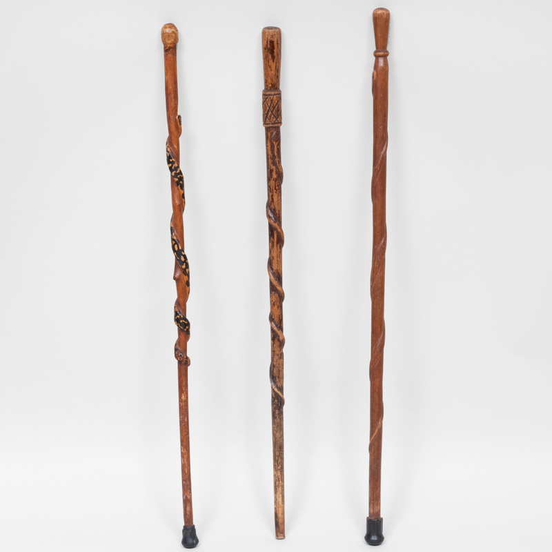 Appraisal: GROUP OF THREE CARVED WOOD CANES The largest in long