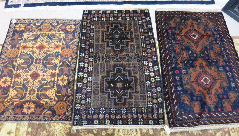 Appraisal: THREE AFGHAN BELOUCHI TRIBAL AREA RUGS all hand knotted predominantly