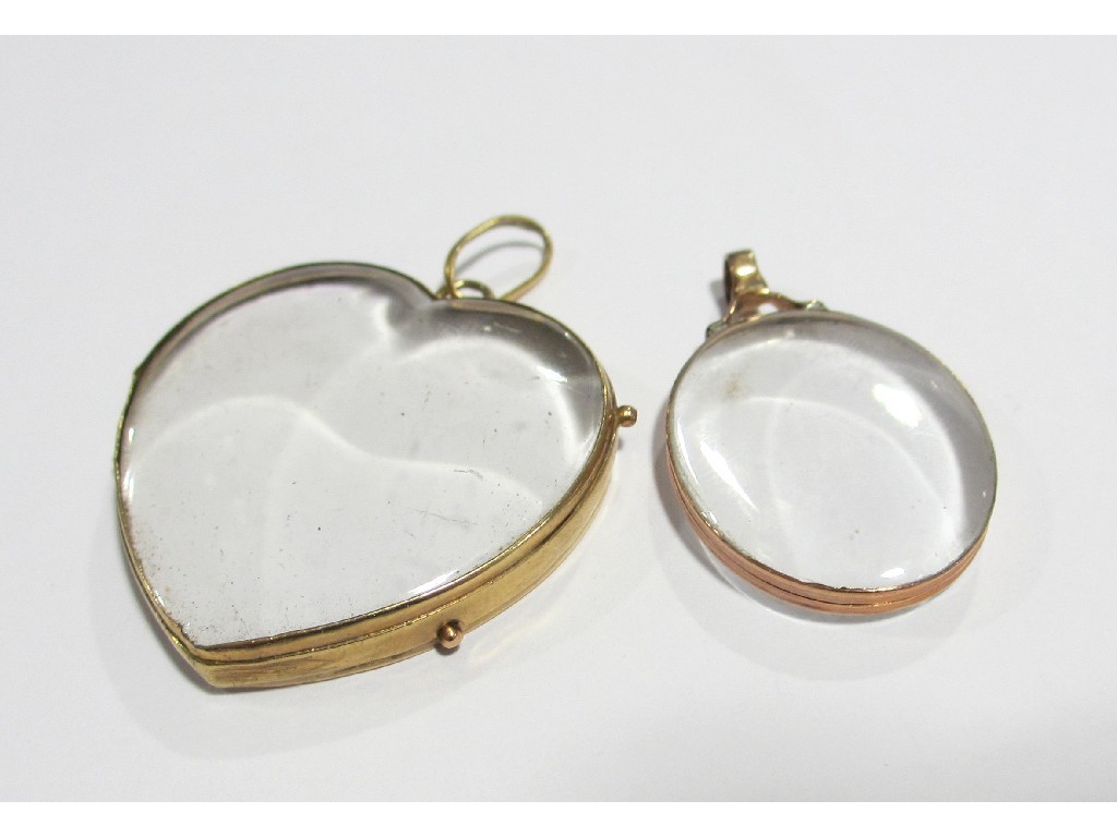 Appraisal: Two Victorian open photo lockets mounted in yellow metal one