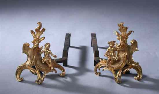 Appraisal: PAIR LOUIS XV STYLE BRONZE-DOR CHENETS th century Scrolling foliate