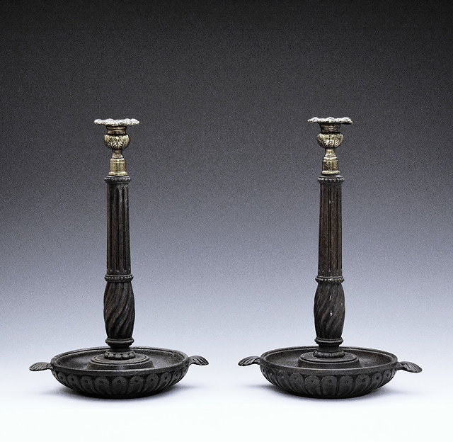 Appraisal: A pair of th Century mahogany column candlestickswith gilt sconces