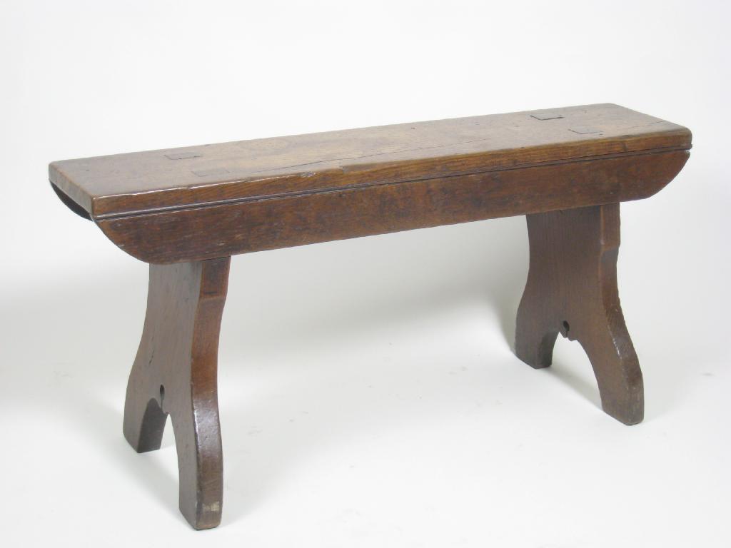 Appraisal: An th Century boarded oak Stool with shaped supports ft