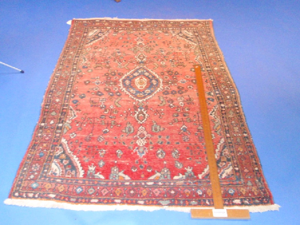 Appraisal: A Turkish design rug red ground with blue and black