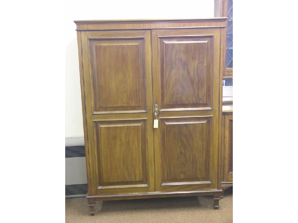 Appraisal: A late Victorian mahogany gentleman's wardrobe enclosed by a pair